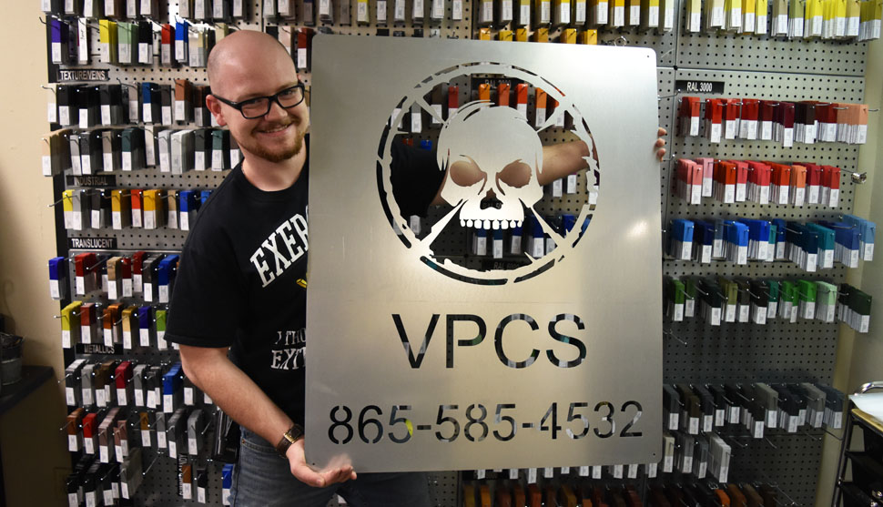 Austin with custom Volunteer Powder Coating Services sign
